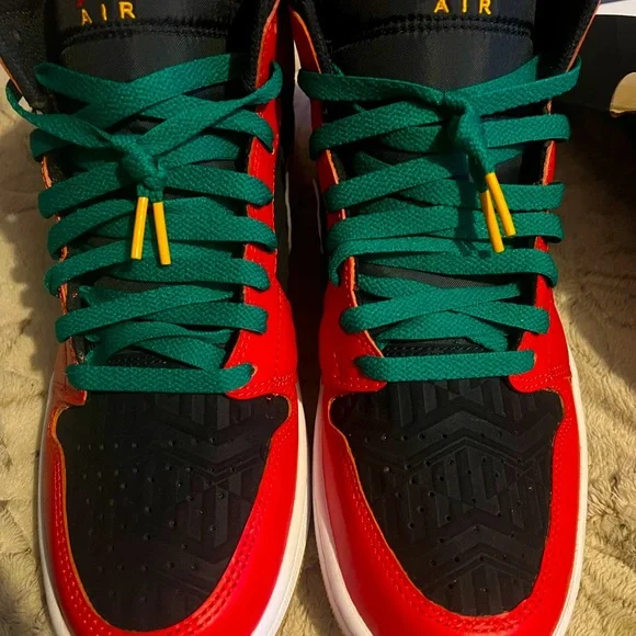 Christmas Jordan 1 they are red,black,and white with green laces and gum bottoms